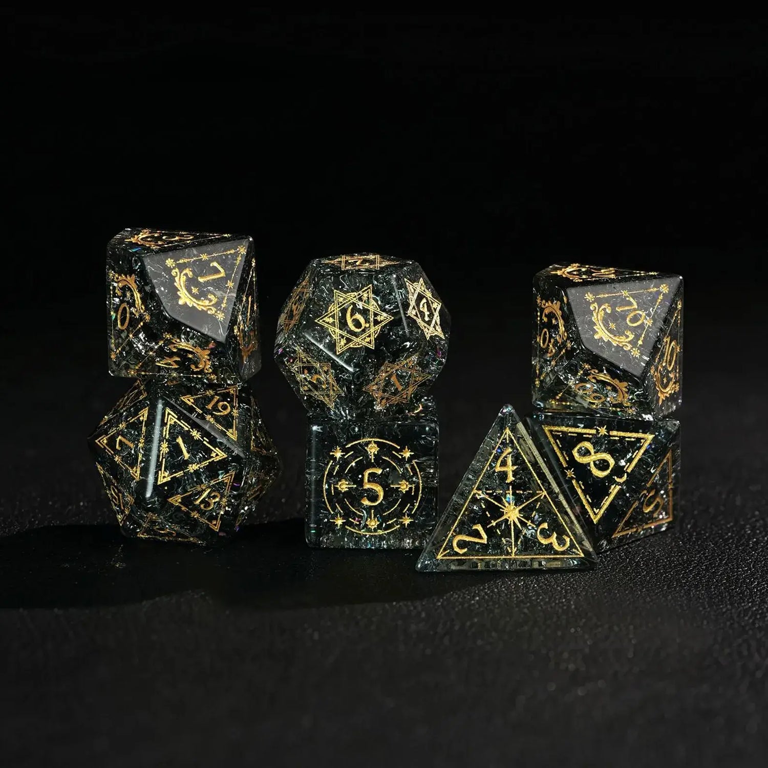 Several of the sharp-edged green glass dice are stacked on top of each other, showcasing their facets, luster, and overall design.