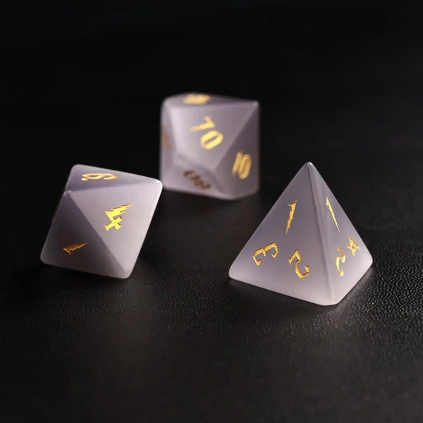 Group of three Grey Cat's Eye Gemstone Dice (e.g., D8, D10, D%) arranged together, perfect for a DND Polyhedral Dice collection on a dark background.