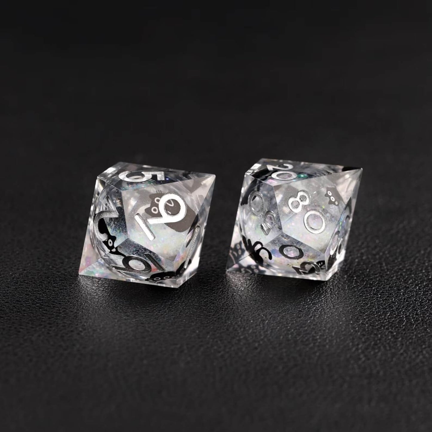 High-contrast photo emphasizing the metallic silver swirl effect of the Liquid Core Dice Resin Set.
