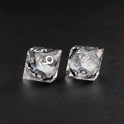High-contrast photo emphasizing the metallic silver swirl effect of the Liquid Core Dice Resin Set.