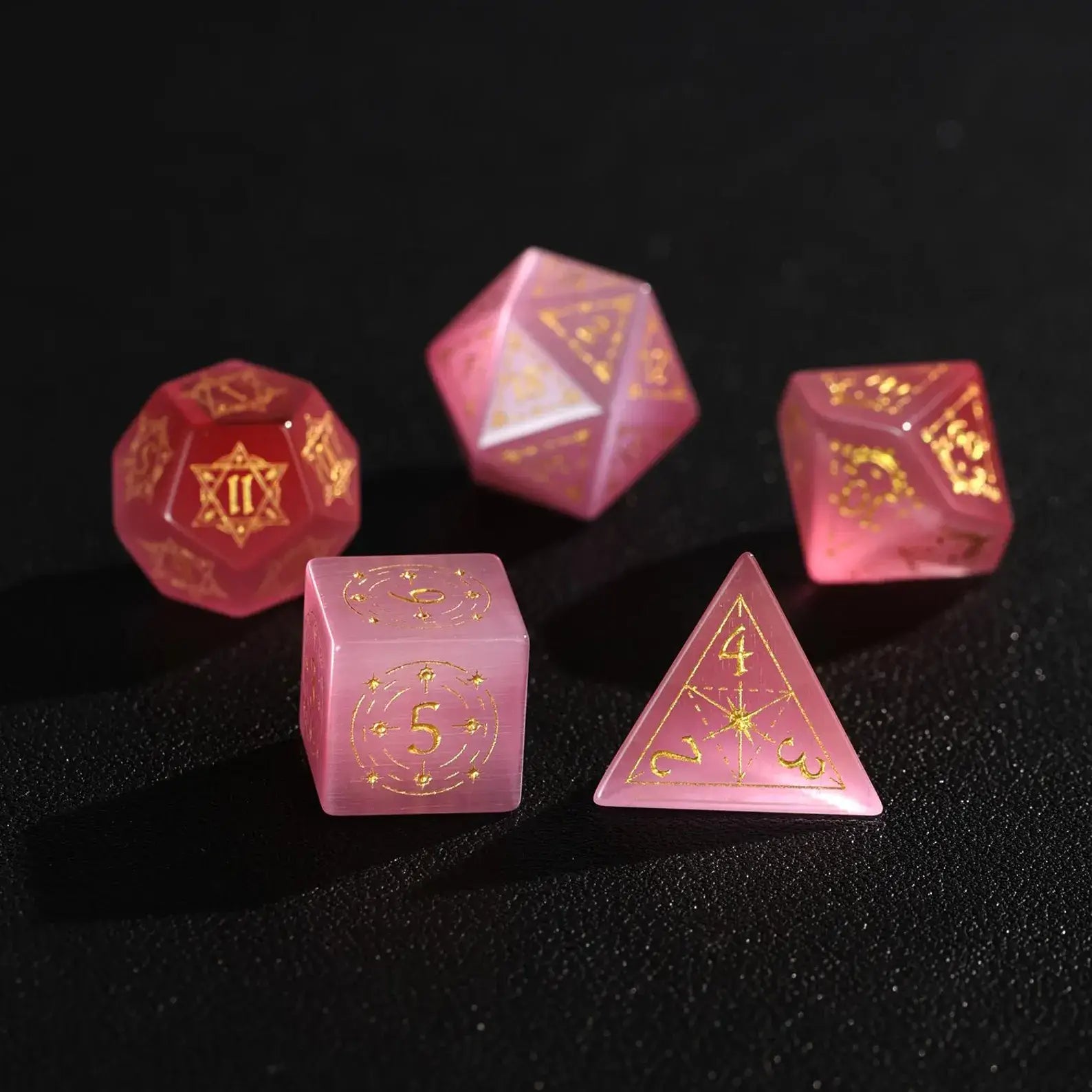 Five pieces of high-quality Pink Cat's Eye Gemstone Dice displayed together, focusing on the luxury feel and precise numerical engraving.