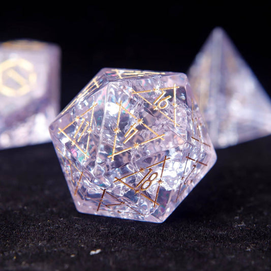 D20 closeup of the Eye of the Demon pattern on vibrant Pink Glass Dice. Sharp edges and gold numbering visible on the black surface.