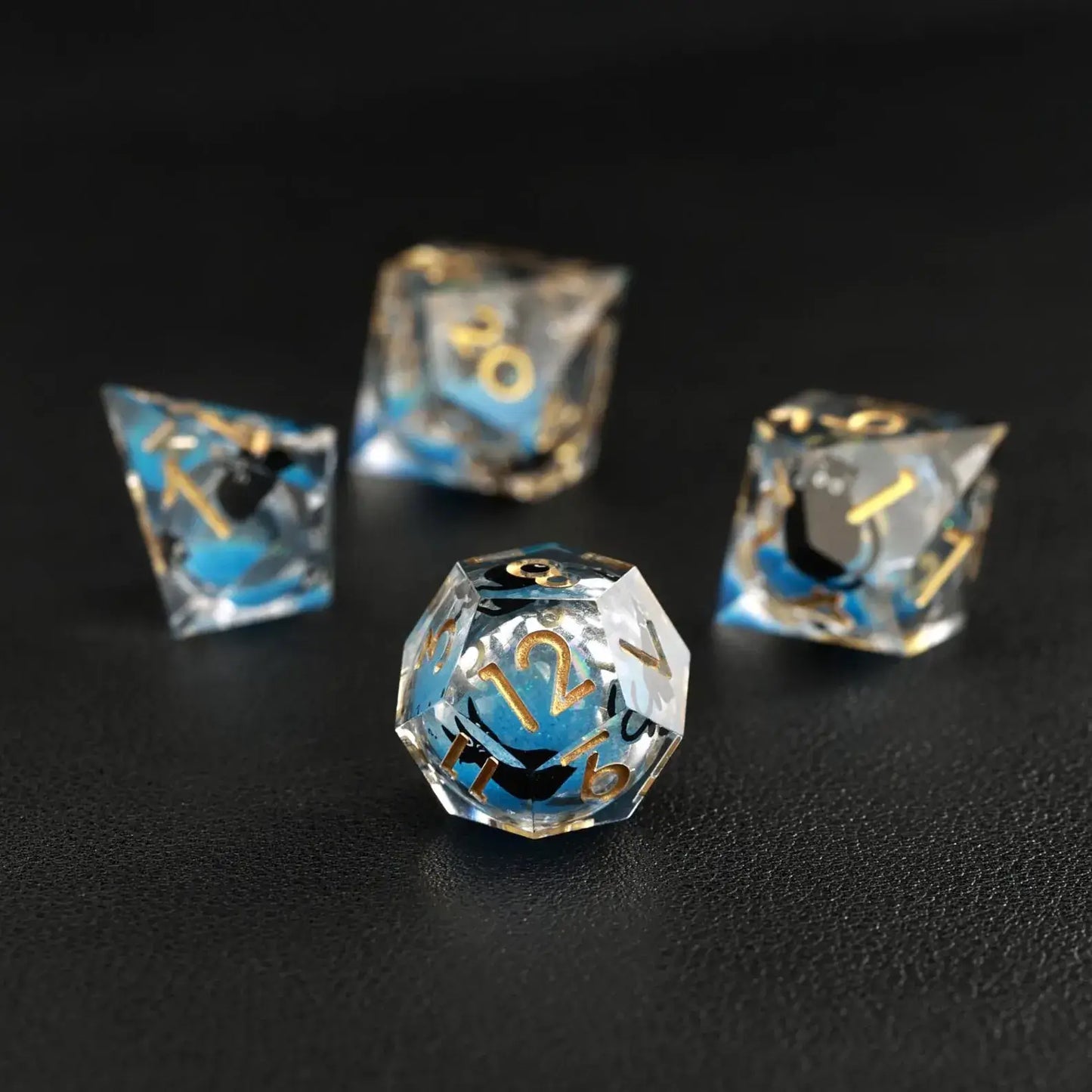 Assortment of polyhedral shapes in the Liquid Core Dice Resin Set with animal dice feature.