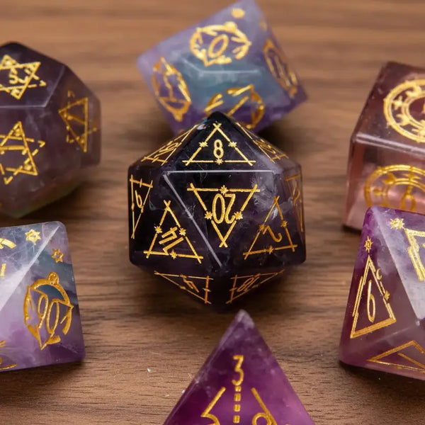 Close-up photo of engraved purple fluorite dice set on walnut wood, featuring a prominent D20 die in focus with the full set neatly aligned.
