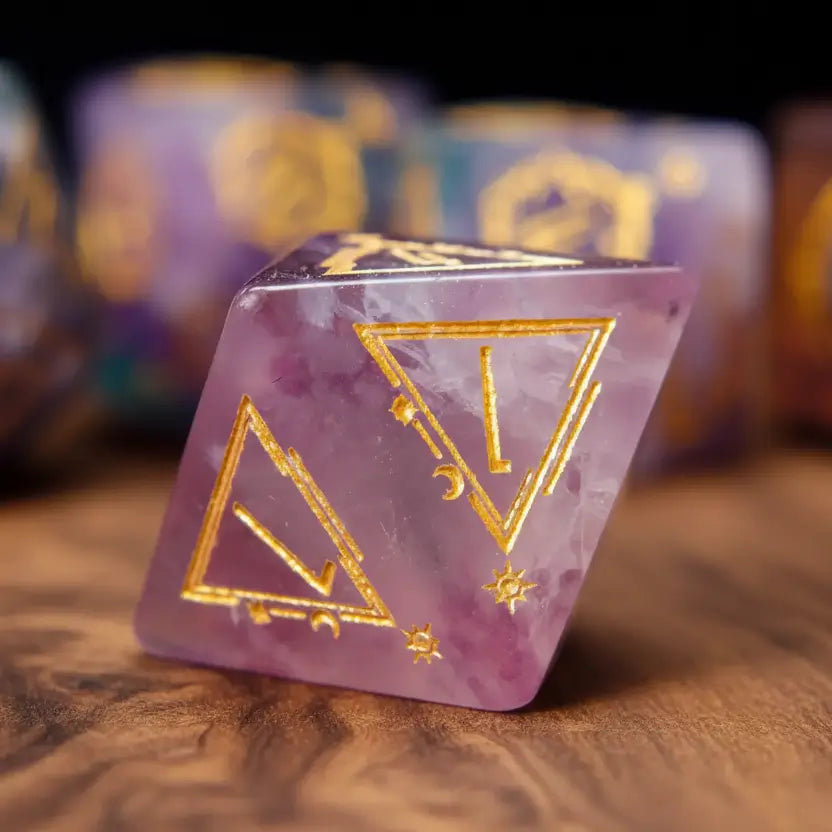 A lone, eight-sided D8 die made from engraved fluorite gemstone, displayed on a smooth walnut wood background.
