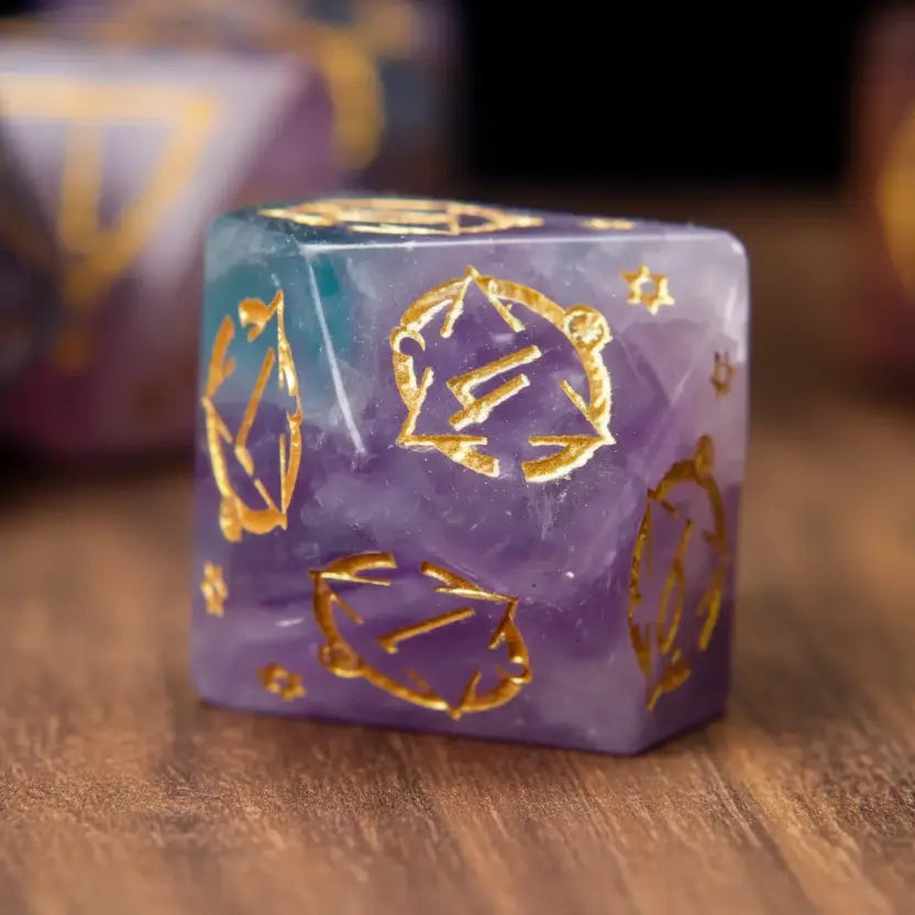 Detailed image of a single purple fluorite D% percentile die, showcasing its gemstone clarity and engraving on a wooden table.