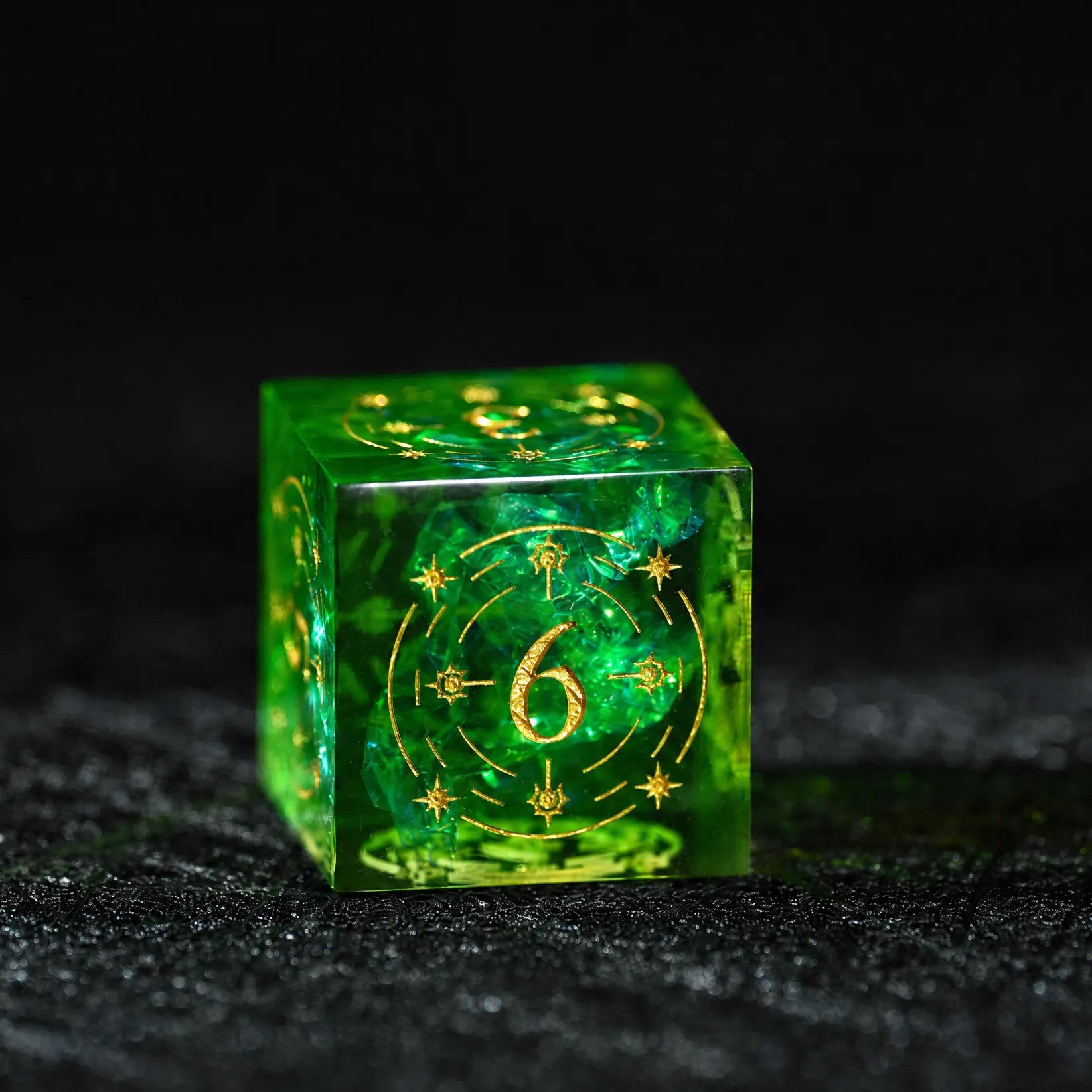 Emerald Cosmic Foil Sharp Edge Resin Dice Set, close-up of the d6 with gold celestial numbers
