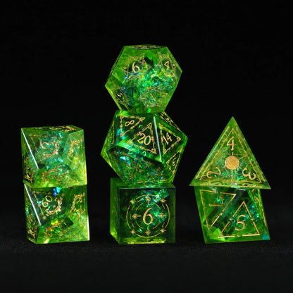 Full seven-piece Emerald Cosmic Foil Sharp Edge Resin Dice Set arranged for DND and tabletop RPG play