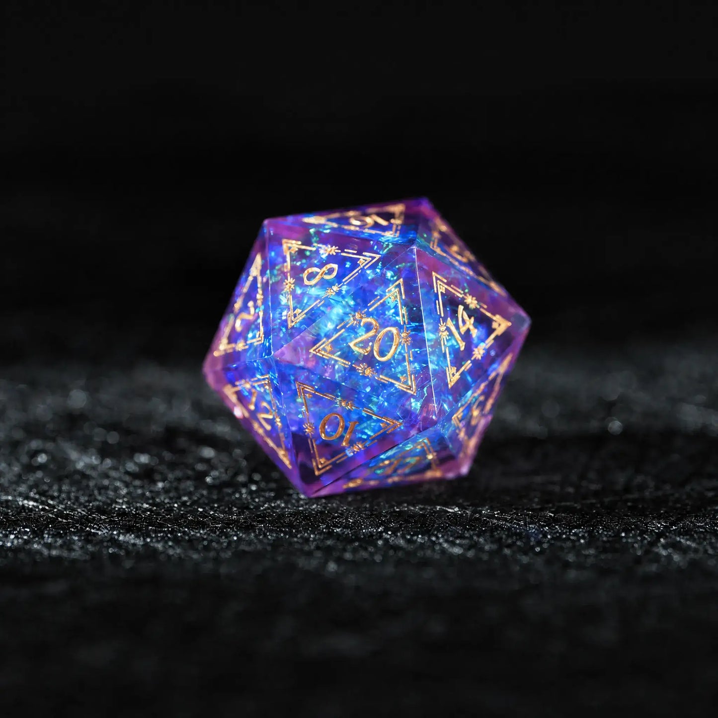 Purple Cosmic Foil Sharp Edge Resin Dice Set, close-up of the d20 with sharp edges and gold numbers