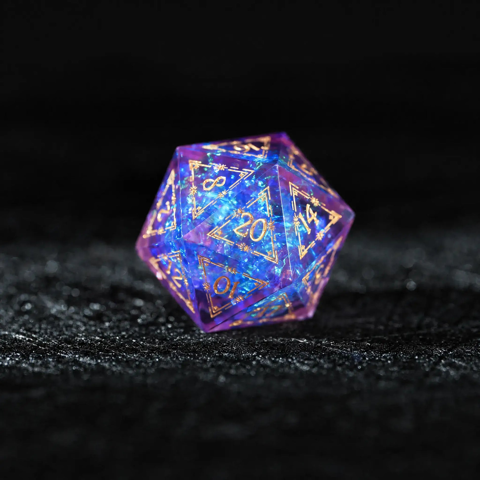 Purple Cosmic Foil Sharp Edge Resin Dice Set, close-up of the d20 with sharp edges and gold numbers