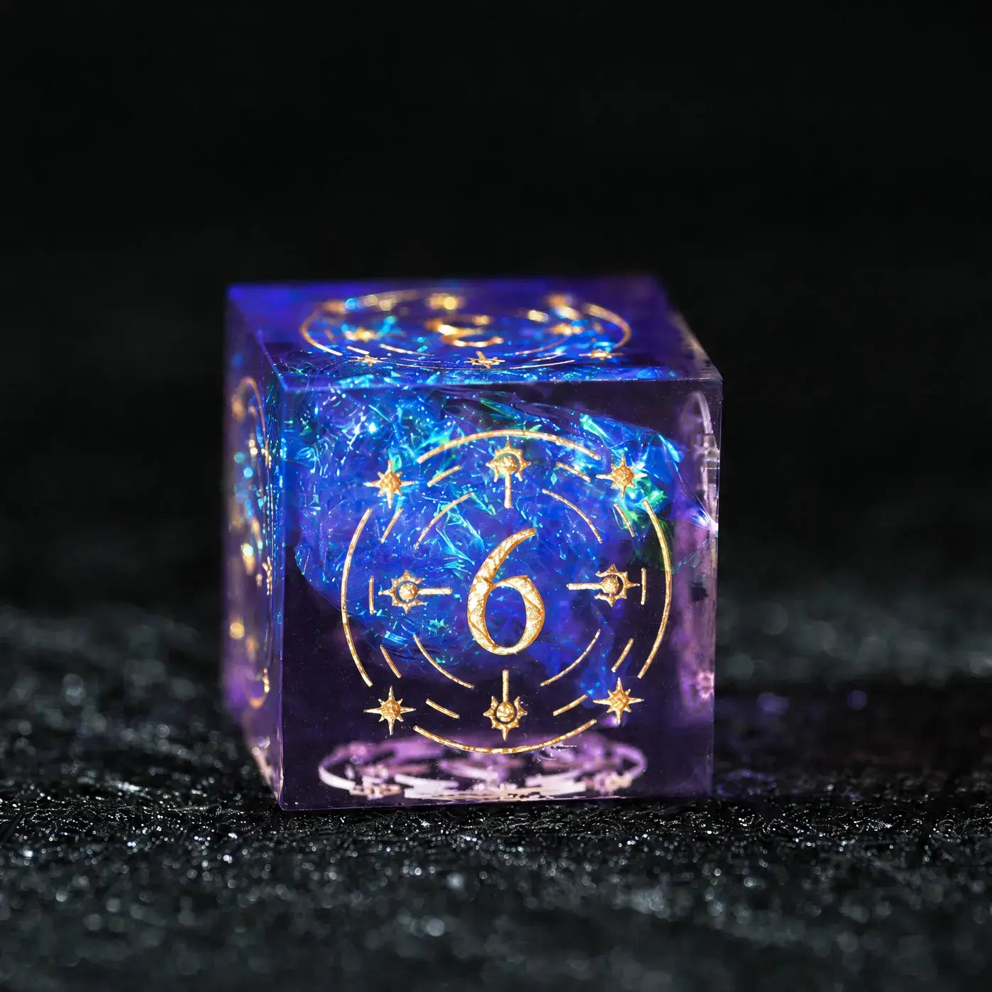 Purple Cosmic Foil Sharp Edge Resin Dice Set, single d6 on a dark tabletop background