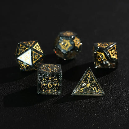 Several of the sharp-edged green glass dice are stacked on top of each other, showcasing their facets, luster, and overall design