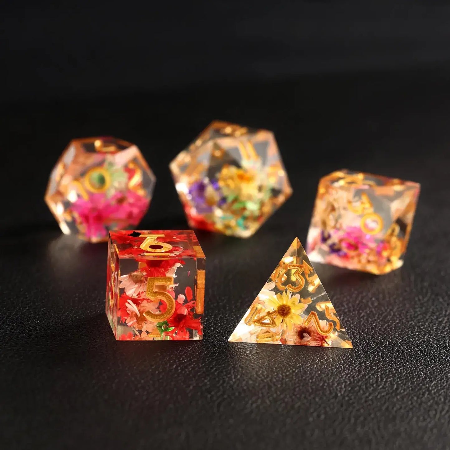 Close-up of the D4 die from the Transparent Floral DND Resin Dice Set, showcasing a delicate flower design suspended in clear resin.