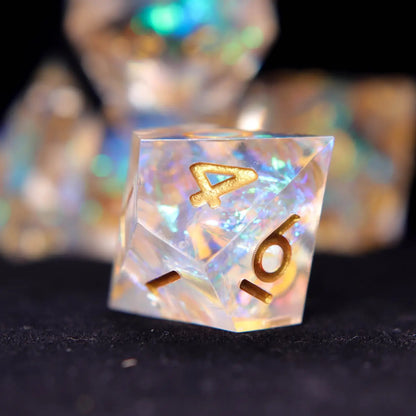 Single rainbow transparent resin D8 reflecting light with clean aesthetic and gold numbers for tabletop RPGs