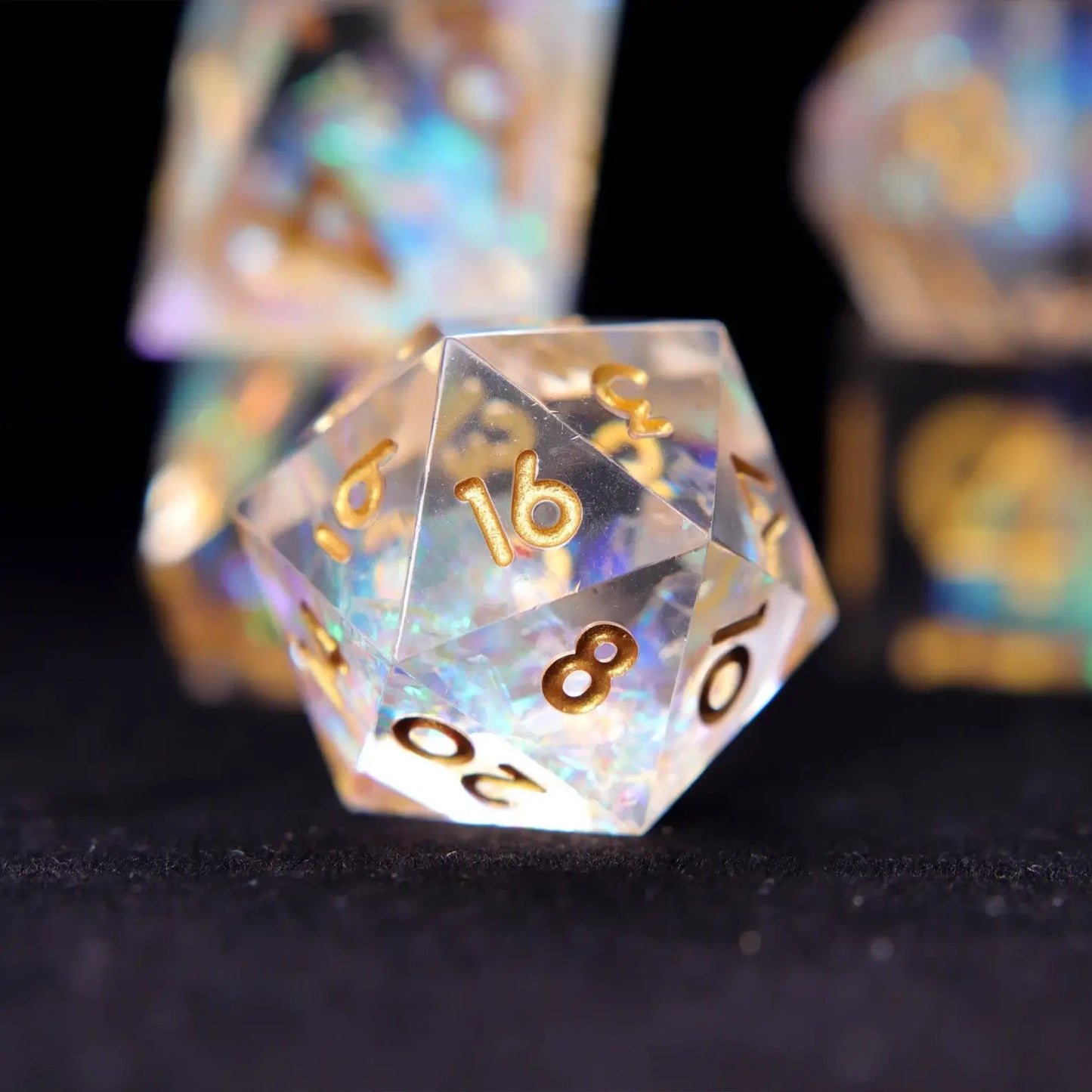 Rainbow transparent resin RPG dice set with gold engraved numbers and soft rainbow tones for female tabletop RPG players