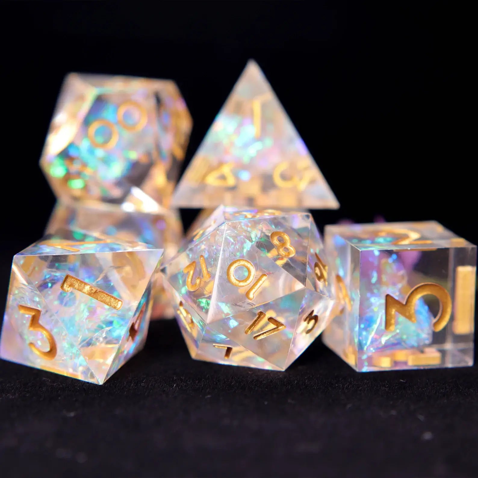 Transparent rainbow resin dice set showing full polyhedral RPG dice designed for story-focused tabletop players