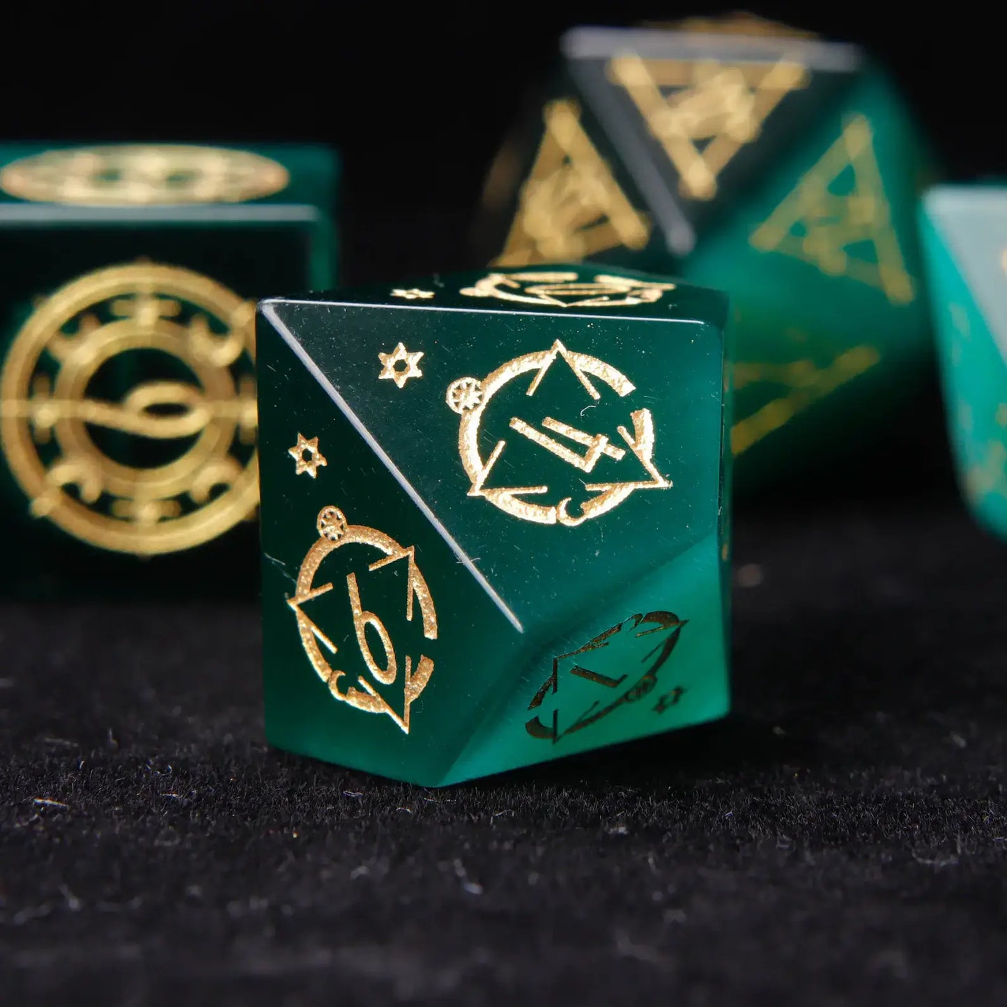 The percentile dice pair (D10 and D00) from the set, featuring the mesmerizing cat's eye stone and matching engraved design.