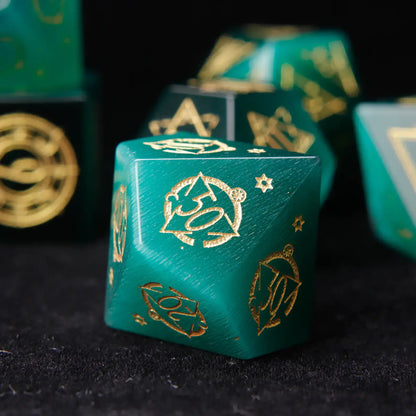 The percentile dice pair (D10 and D00) from the set, featuring the mesmerizing cat's eye stone and matching engraved design.