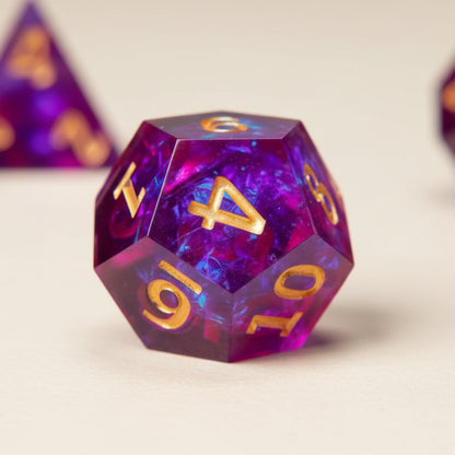 Detailed shot featuring the D12 dice, focusing on the crisp numbers and brilliant holographic finish against cream.