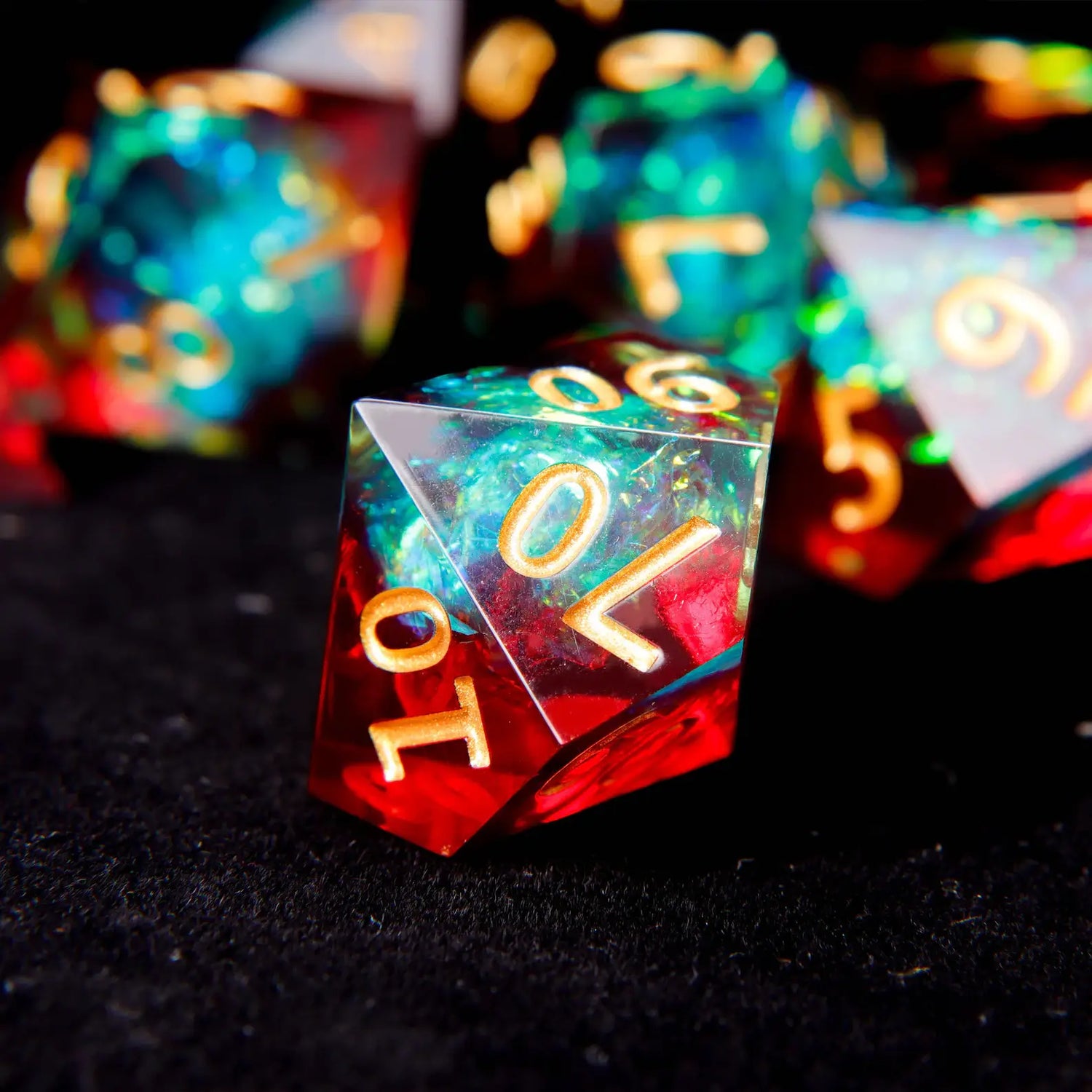 The percentile die (D00, showing tens digits 00-90) with matching engraved style, used for generating numbers from 1-100.