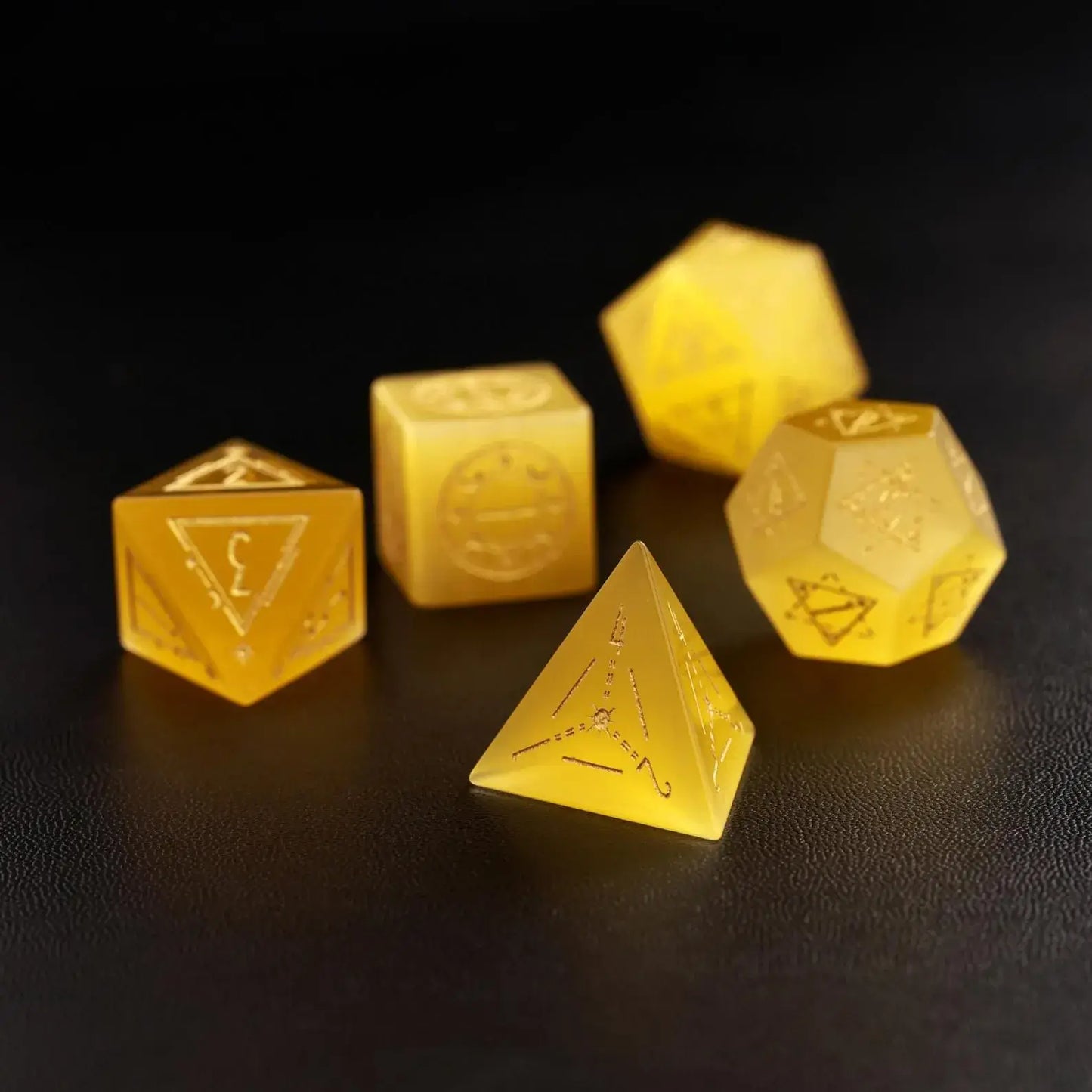 Five pieces of high-quality Yellow Cat's Eye Gemstone Dice displayed together, focusing on the luxury feel and precise numerical engraving.