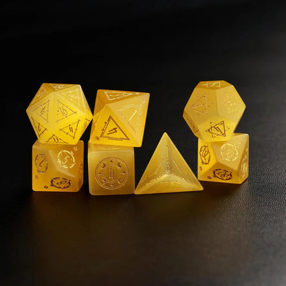 Six Handcrafted DND Yellow Cat's Eye Polyhedral Dice laid out, demonstrating the various shapes included in the set.