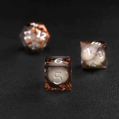 Black Copper Foil Liquid Core D6 resin dice showing glittering liquid core and brass ring detailing
