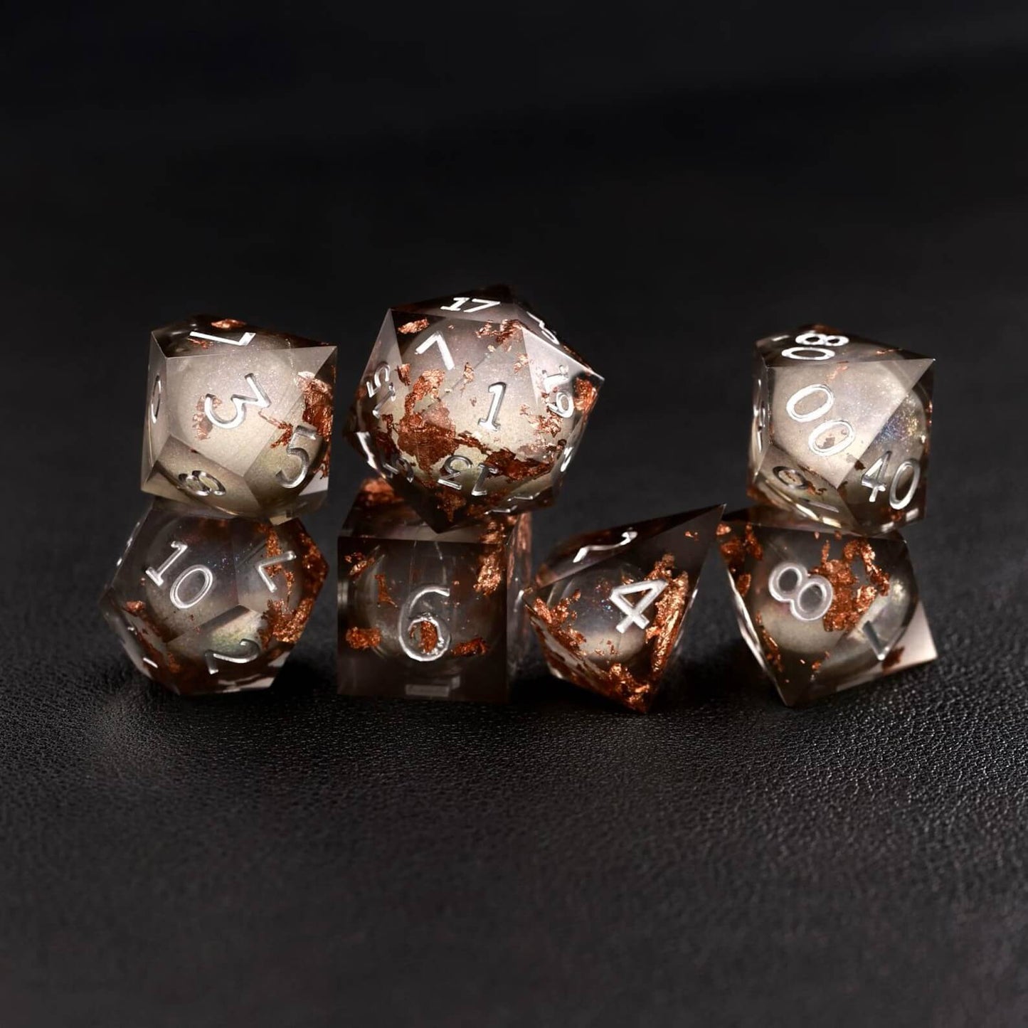 Black Copper Foil Liquid Core DND Resin Dice rolling on tabletop for DND gameplay