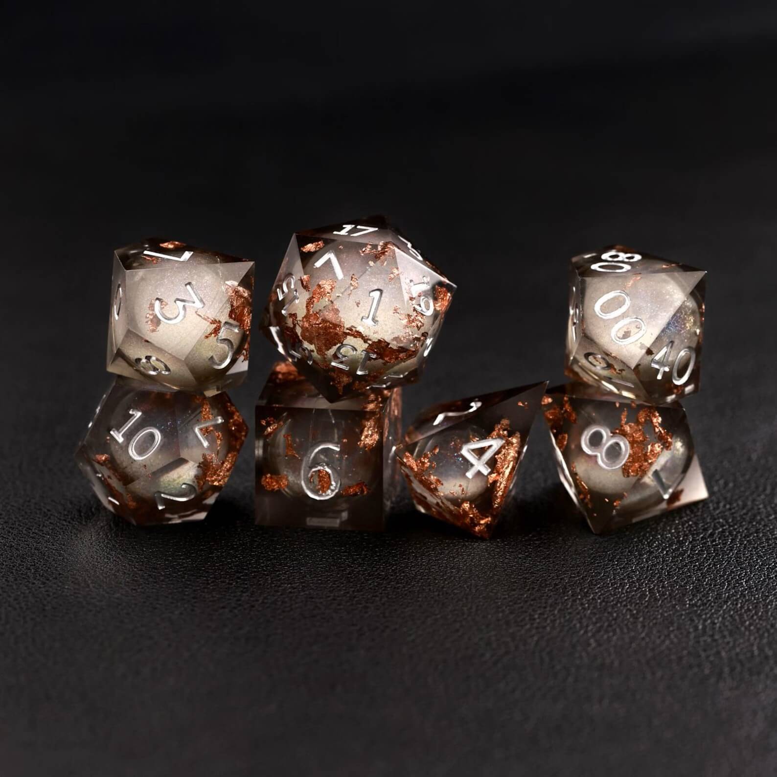 Black Copper Foil Liquid Core DND Resin Dice rolling on tabletop for DND gameplay