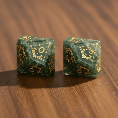 Complete set of engraved Bloodstone gemstone dice elegantly arranged on a rich walnut wood table