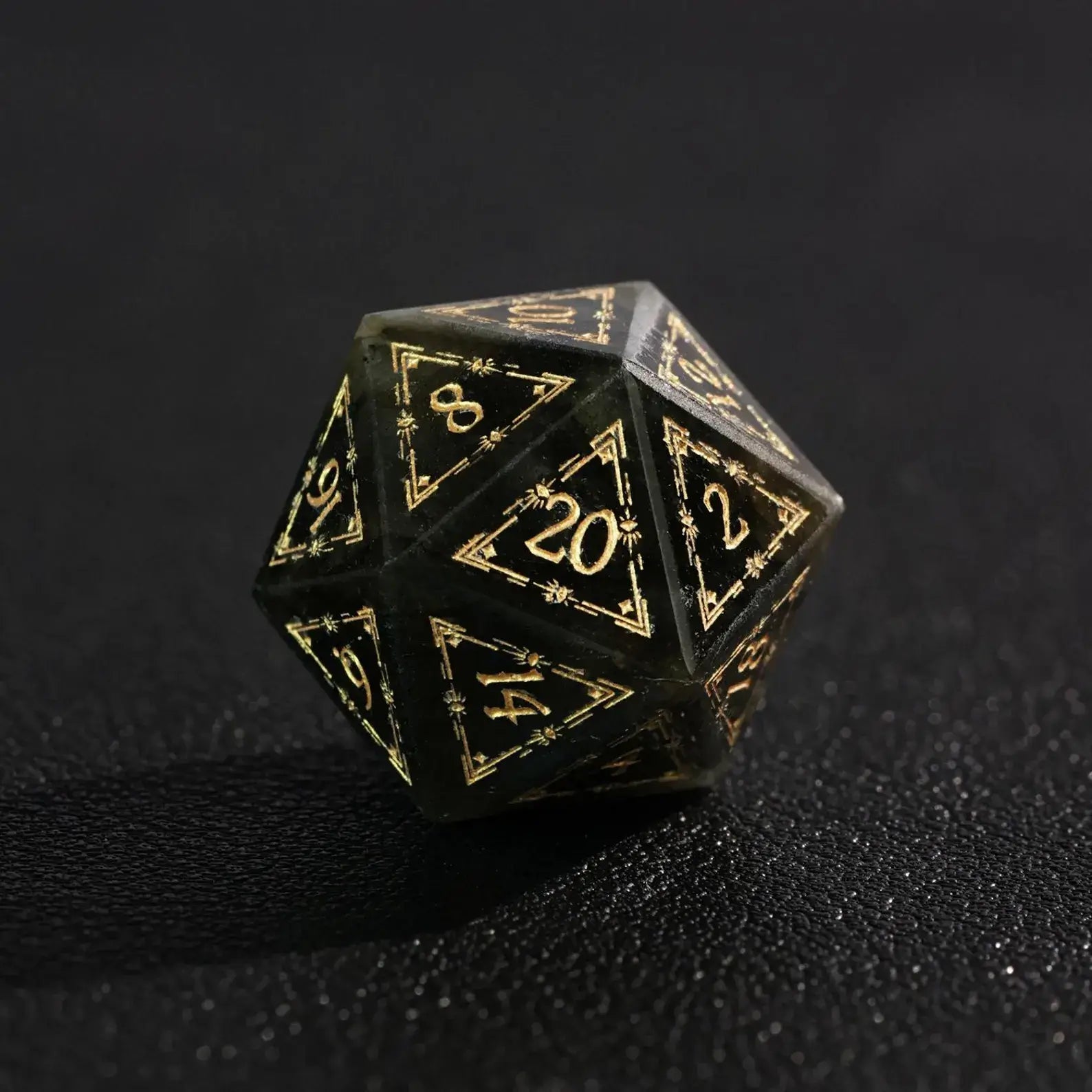 Close-up of the D20 from the Blue Labradorite DND Dice Set, highlighting the shimmering golden pyrite inclusions in the crystal.