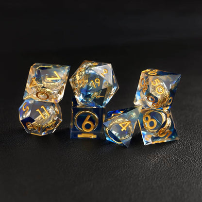Blue Brass Ring DND Resin Dice full set displayed with RPG miniatures and character sheets