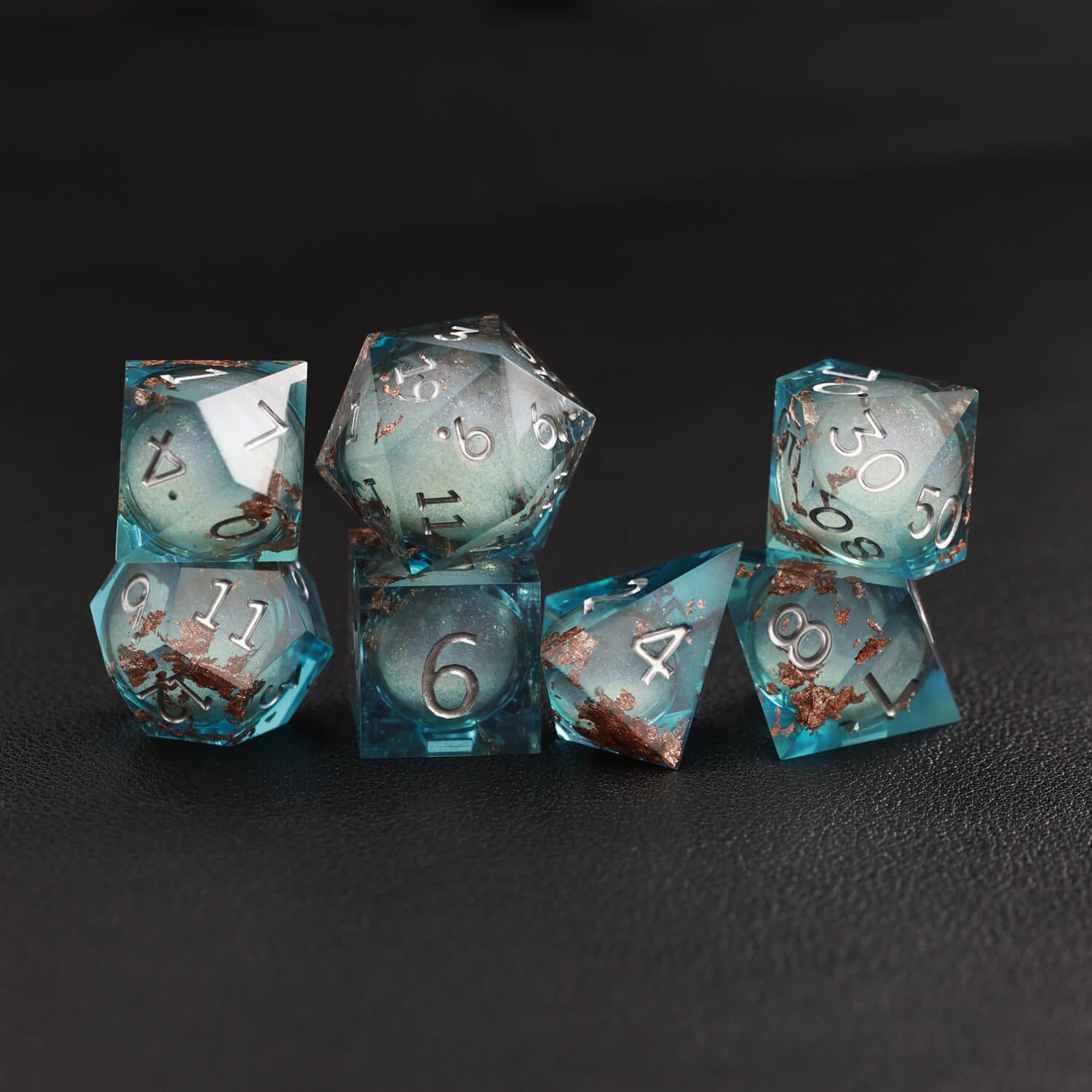 Blue Copper Foil Liquid Core DND Resin Dice rolling on tabletop for DND gameplay