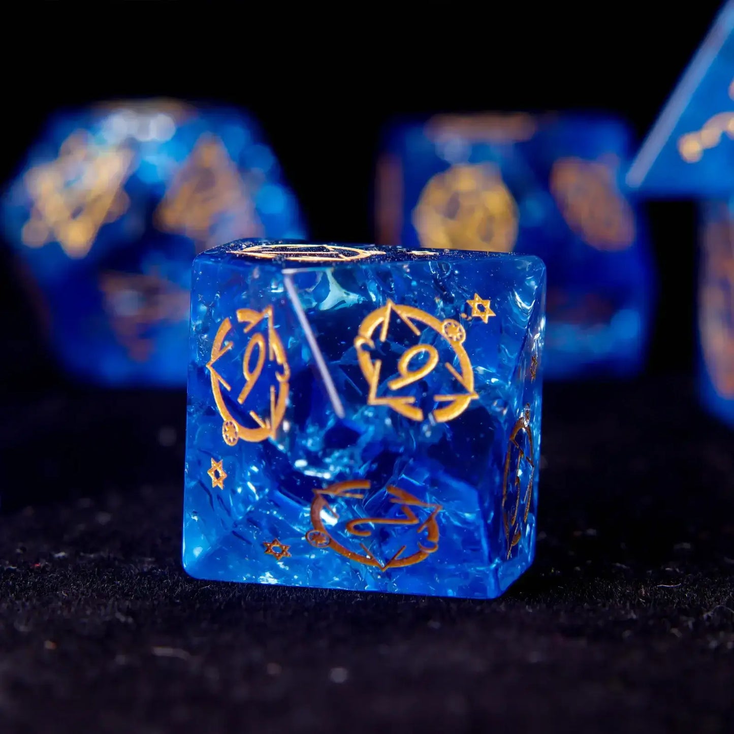 Close-up on the face of the standard D10 crystal dice. Showcases the clean number engraving and the jewel-like clarity of the blue glass dice.
