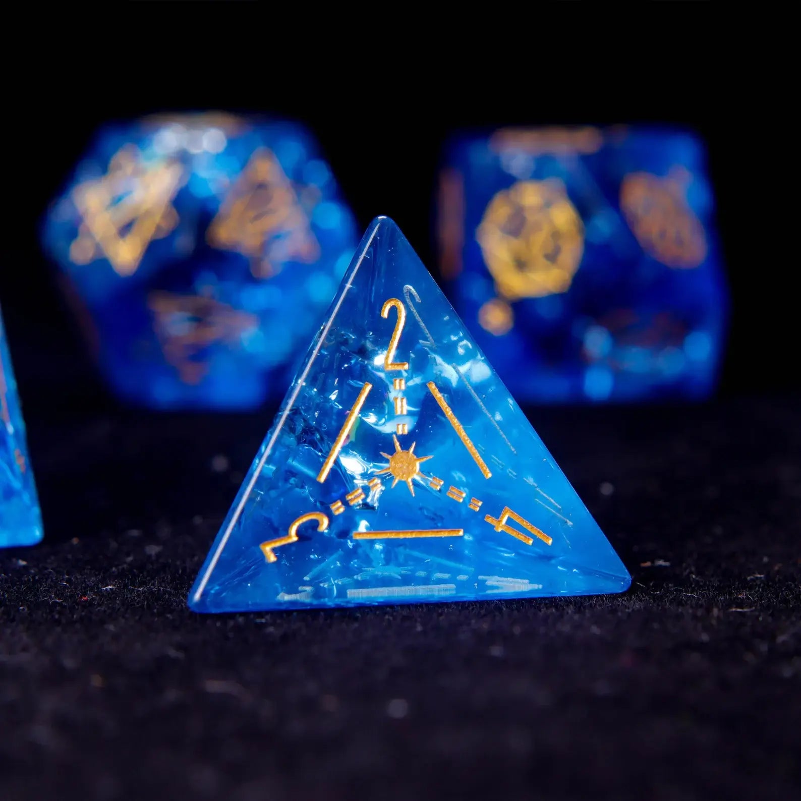 The pyramid-shaped D4, a unique piece of crystal dice. Its sharp edges and pointed tip gleam, with star-like sparkles trapped inside.