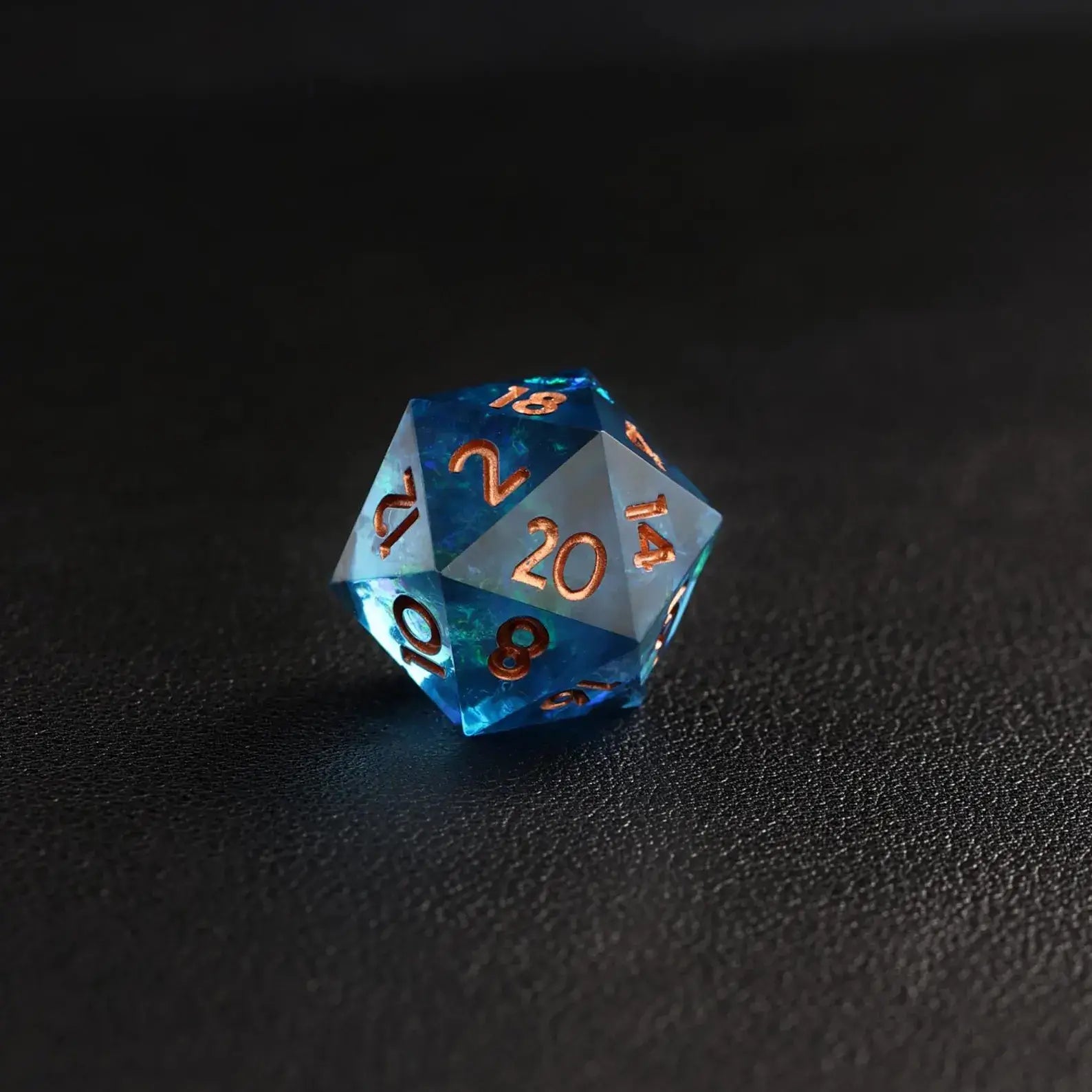 Blue Lightning Resin DND Dice D20 extreme close-up, showcasing sharp edge detail and electric blue swirl.