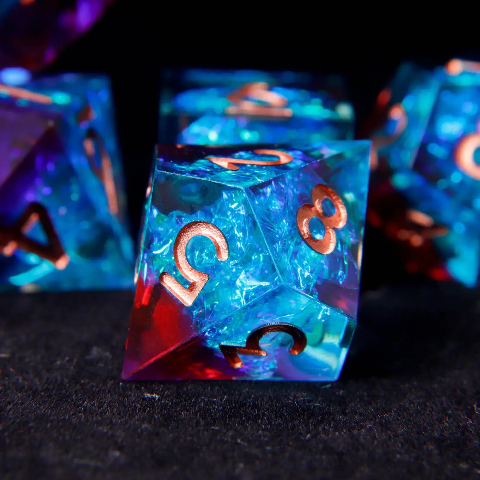 Percentile D% die with holographic blue-red laser effect and matching rose gold numbers. Captures light brilliantly from every angle.