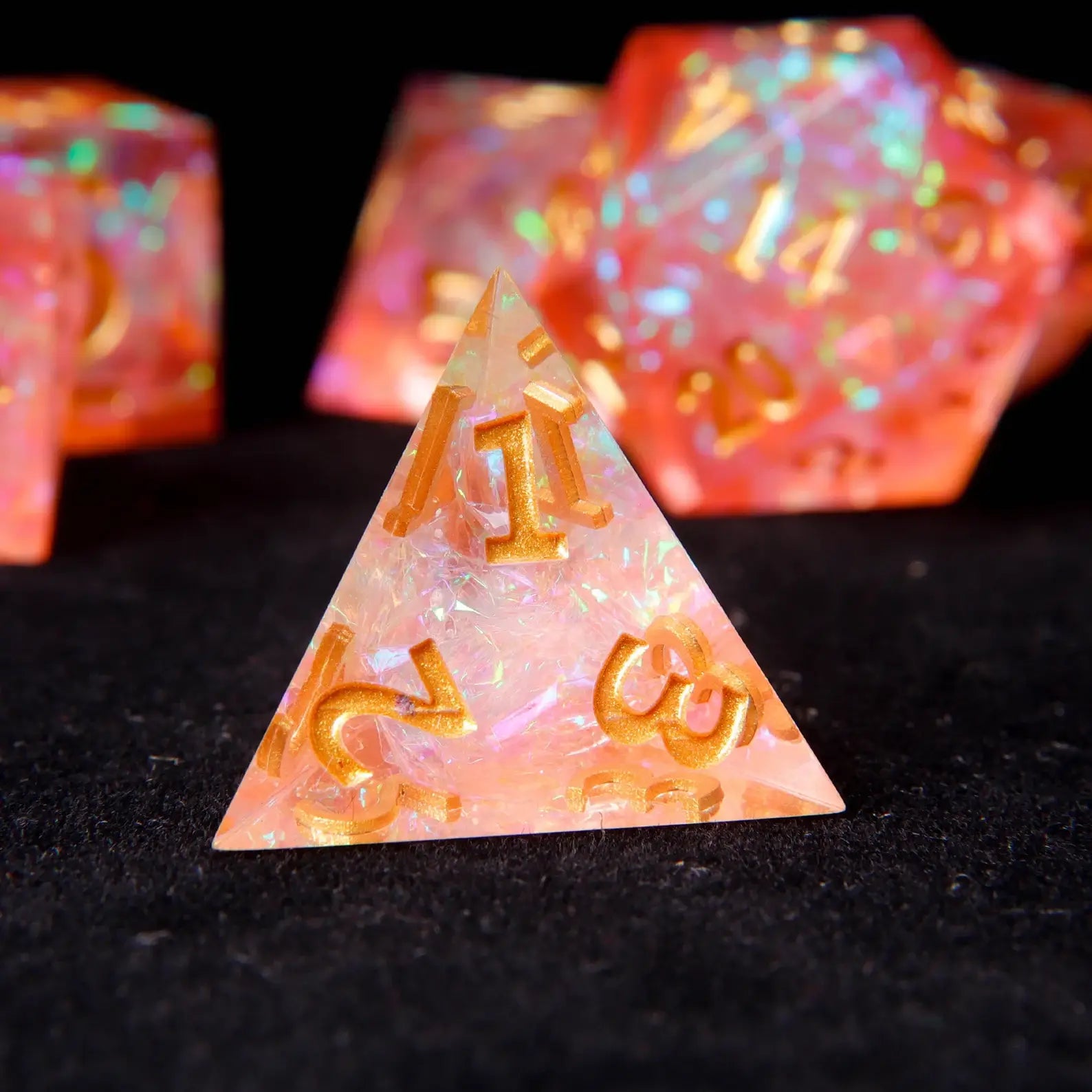 Cool dnd dice sets made of prismatic orange resin with nectarine hues