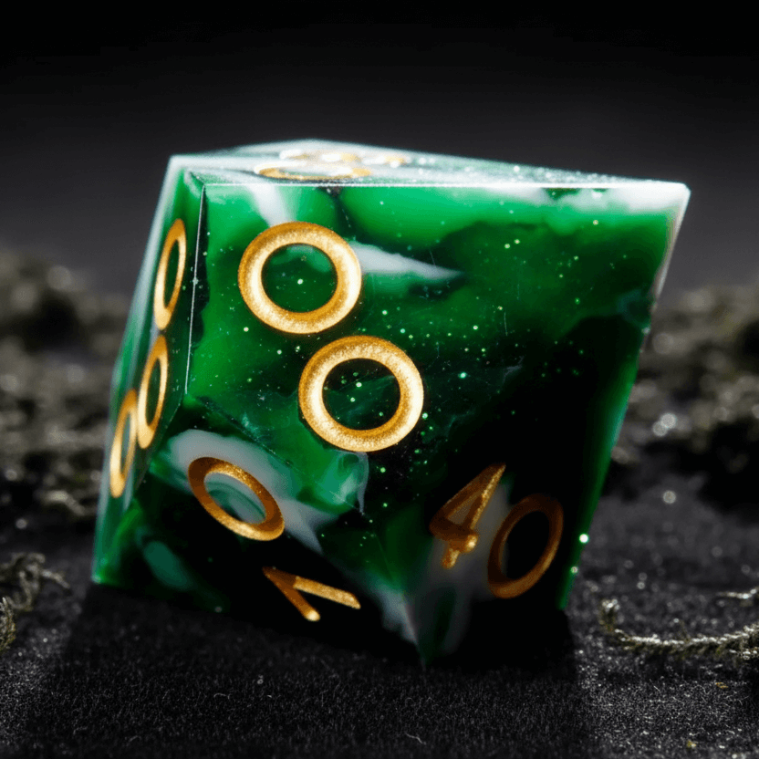 Detailed close-up of the D10 percentile dice from the Green Snow Moss resin dice set, showing dual-digit faces and green-white marbled texture
