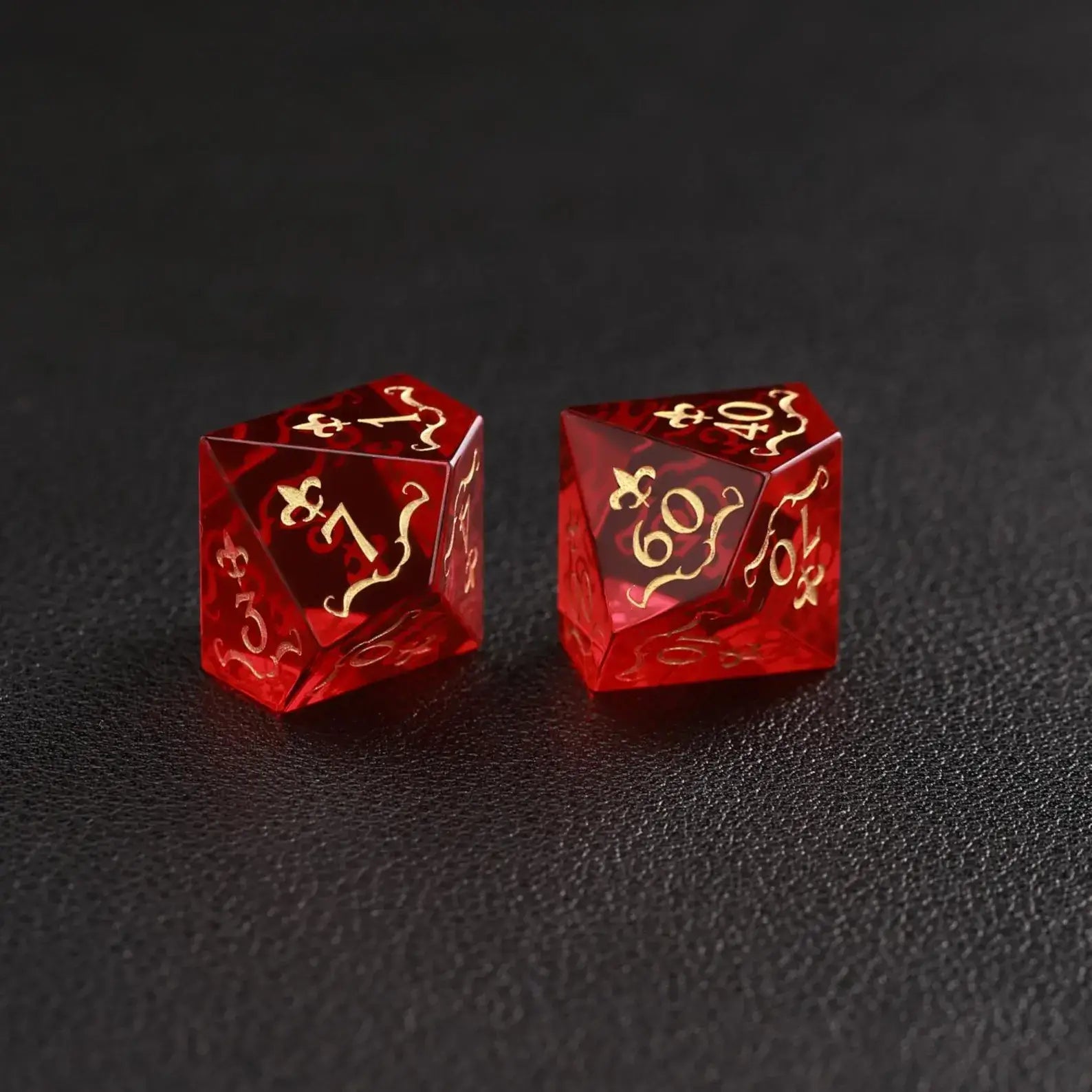 The Garnet D10 and Percentile Dice pair on black background, showing clear numbering and natural stone variations.