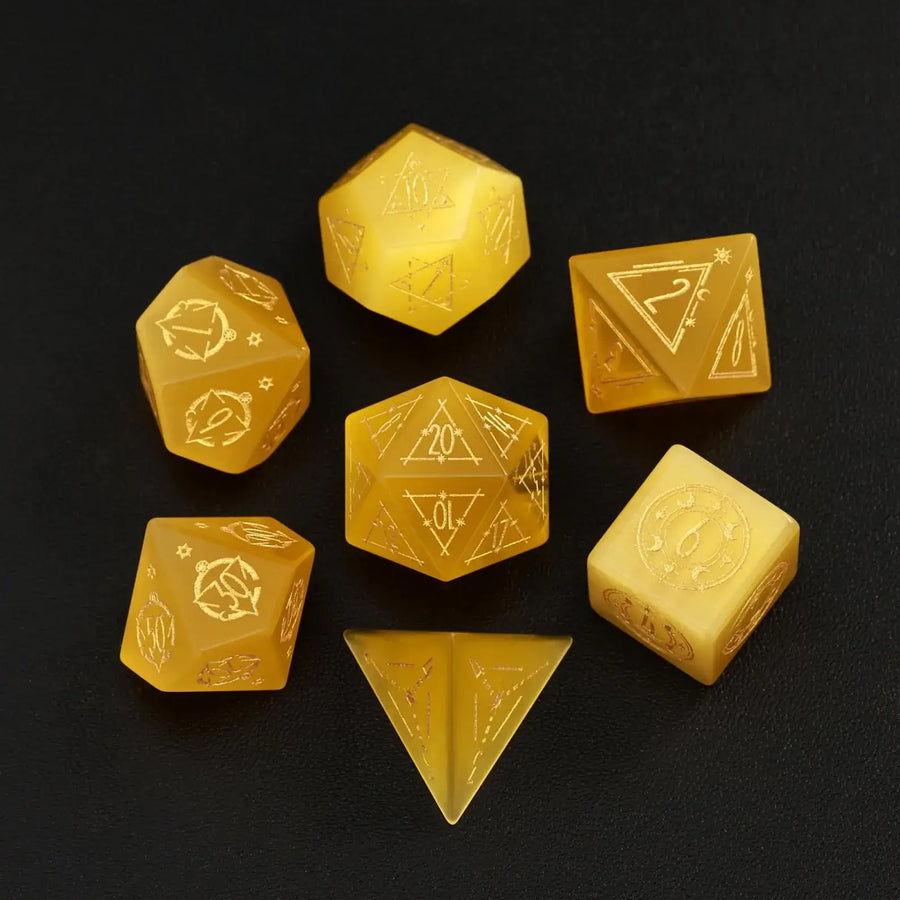 The complete 7-piece Yellow Cat's Eye Gemstone Dice Set (D4-D20) fully displayed on a black background, the essential Polyhedral Dice collection.