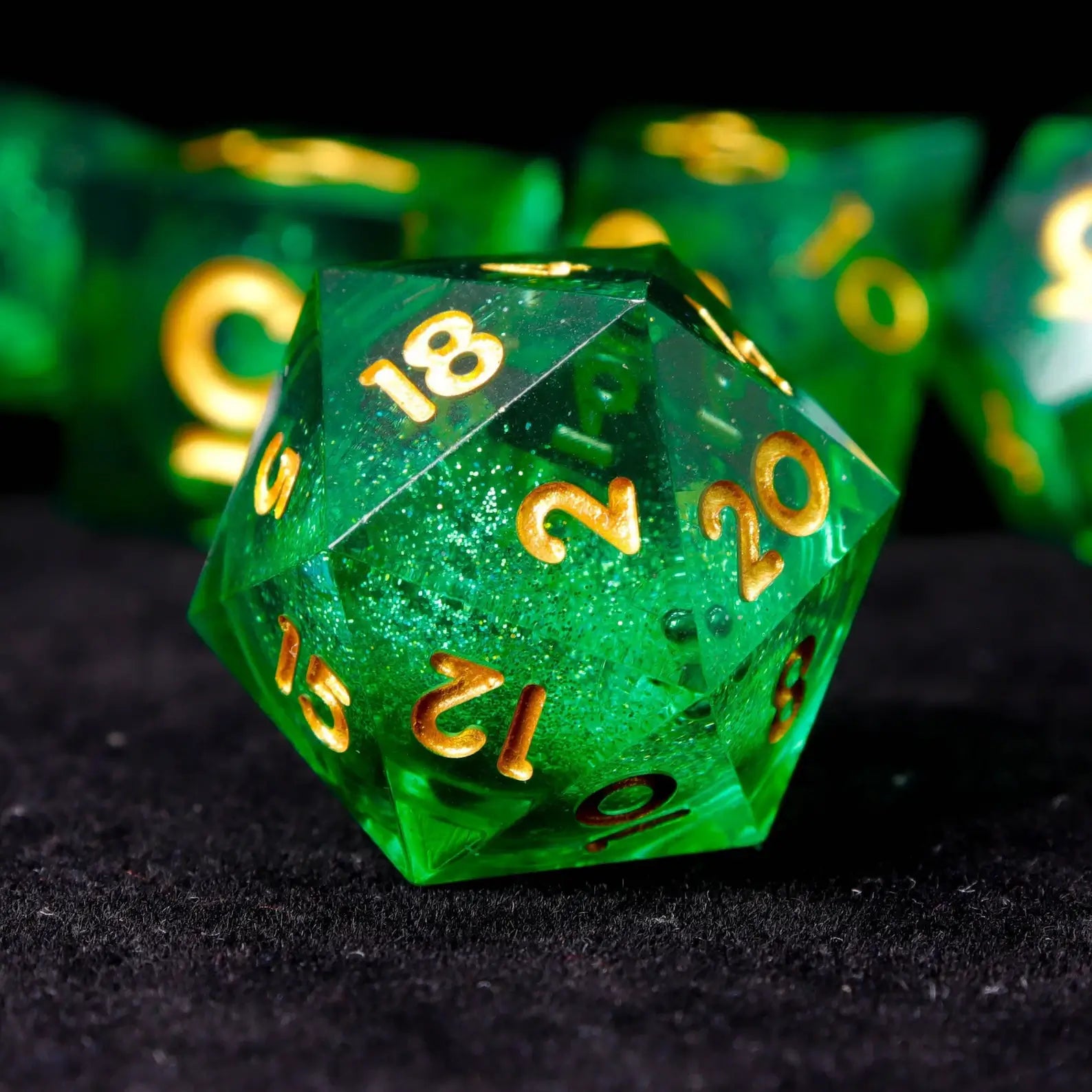 Detail of deep-etched numbers on green resin dice for high readability and durability.