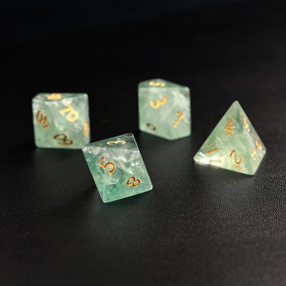 A player's hand holding the Green Fluorite D20 ready to roll, emphasizing the dice's comfortable feel and size.