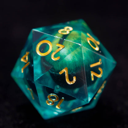 Close-up view of the giant Demon Eye D20 sharp-edge resin dice with detailed glowing eye core