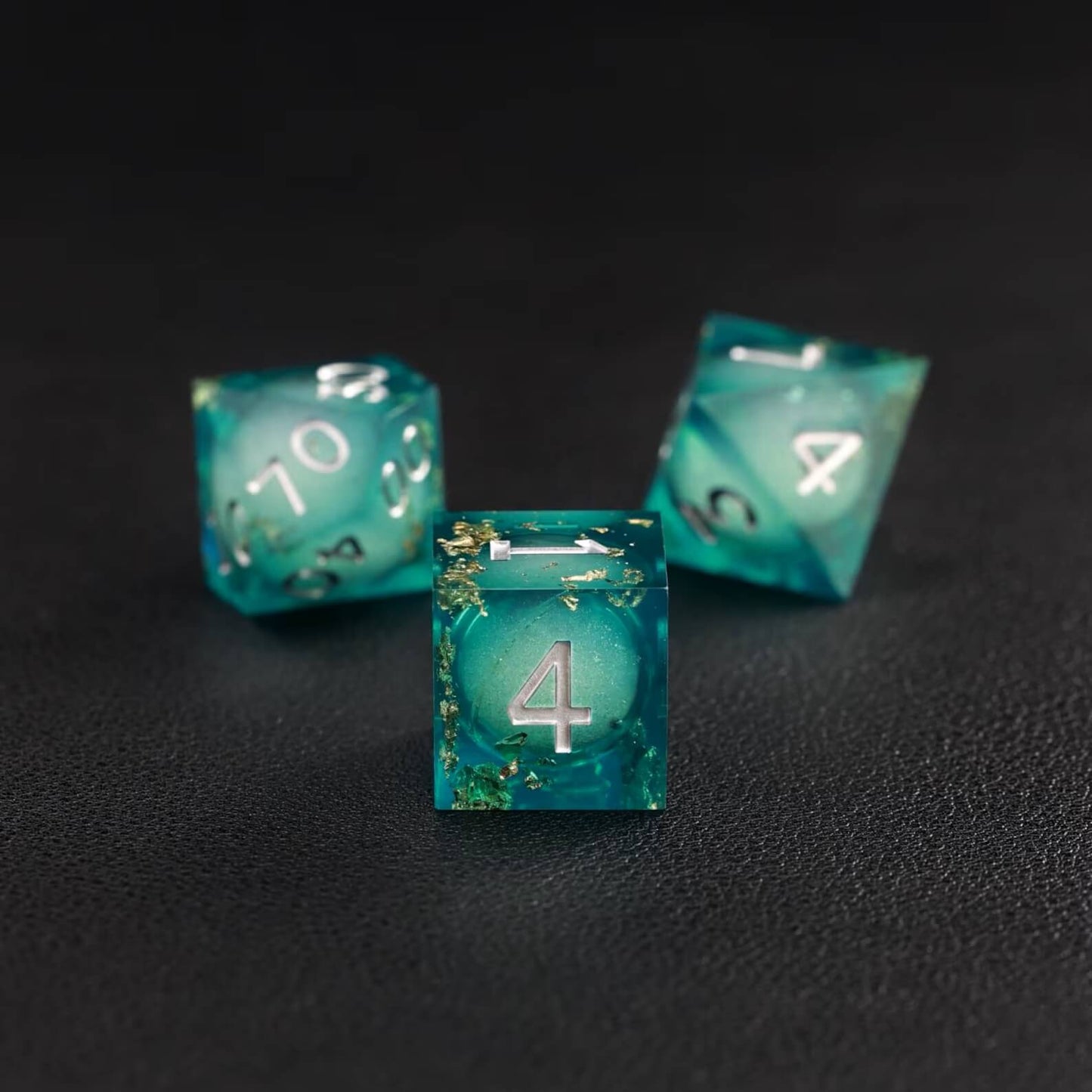 Green Copper Foil Liquid Core D6 resin dice showing glittering liquid core and brass ring detailing
