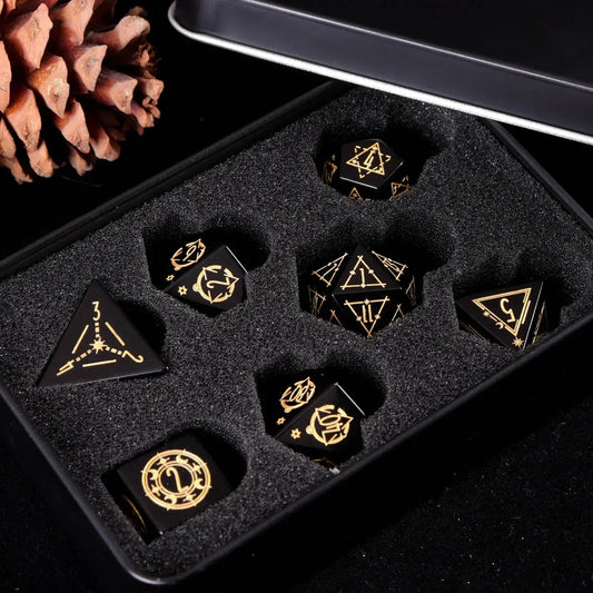 Hand-carved black Obsidian DND dice neatly stored in a sleek metal box, perfect for collectors and safe tabletop storage