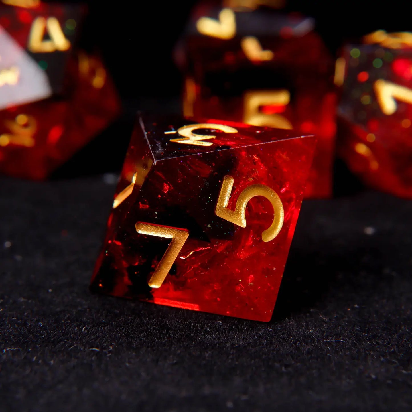 Top-down view demonstrating the clear readability of metallic gold ink against the deep fiery red resin background.