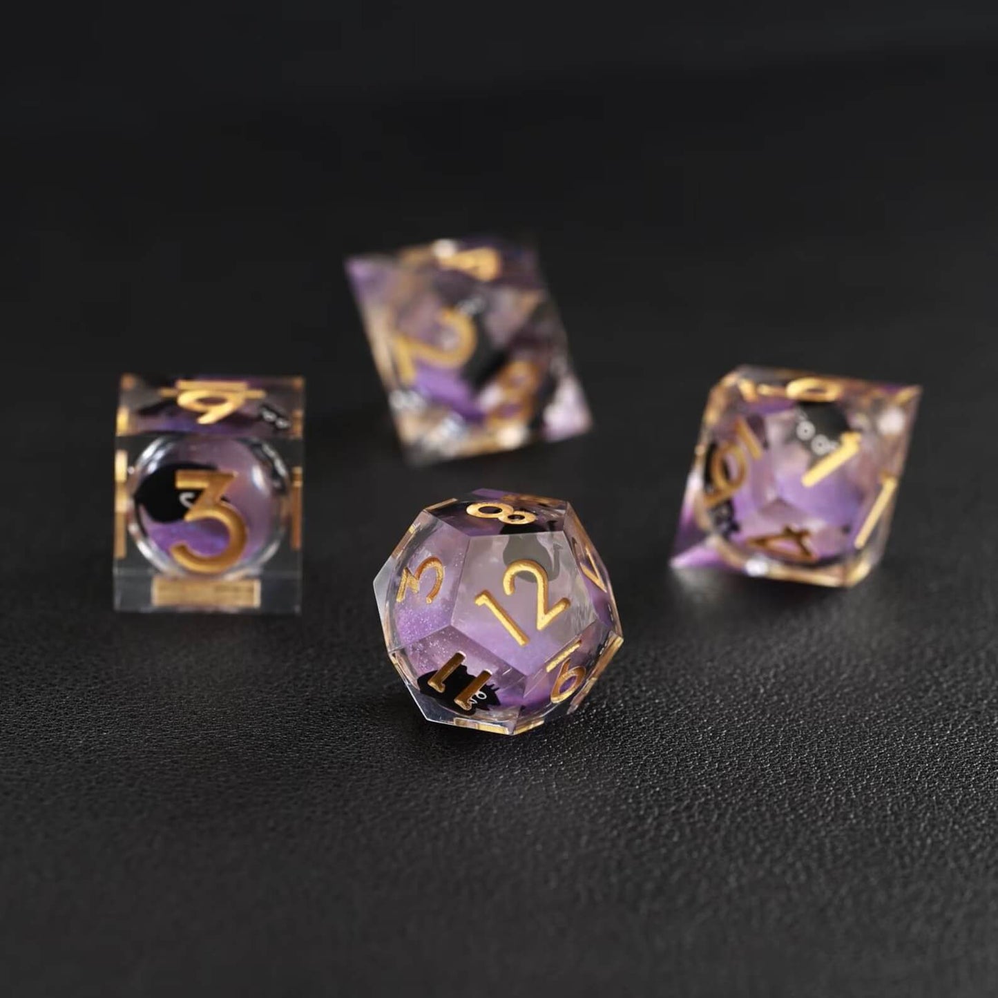 Detailed view of purple resin Liquid Core Dice with black cat animal core suspended inside transparent liquid