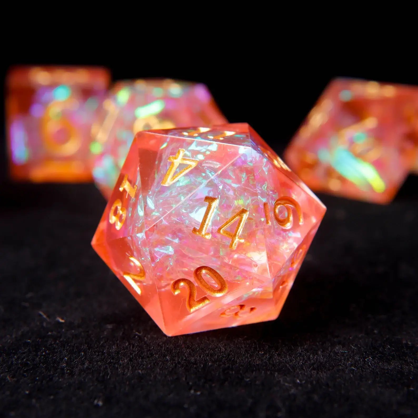 Macro shot of a holographic orange pink d20 die with precision sharp edges