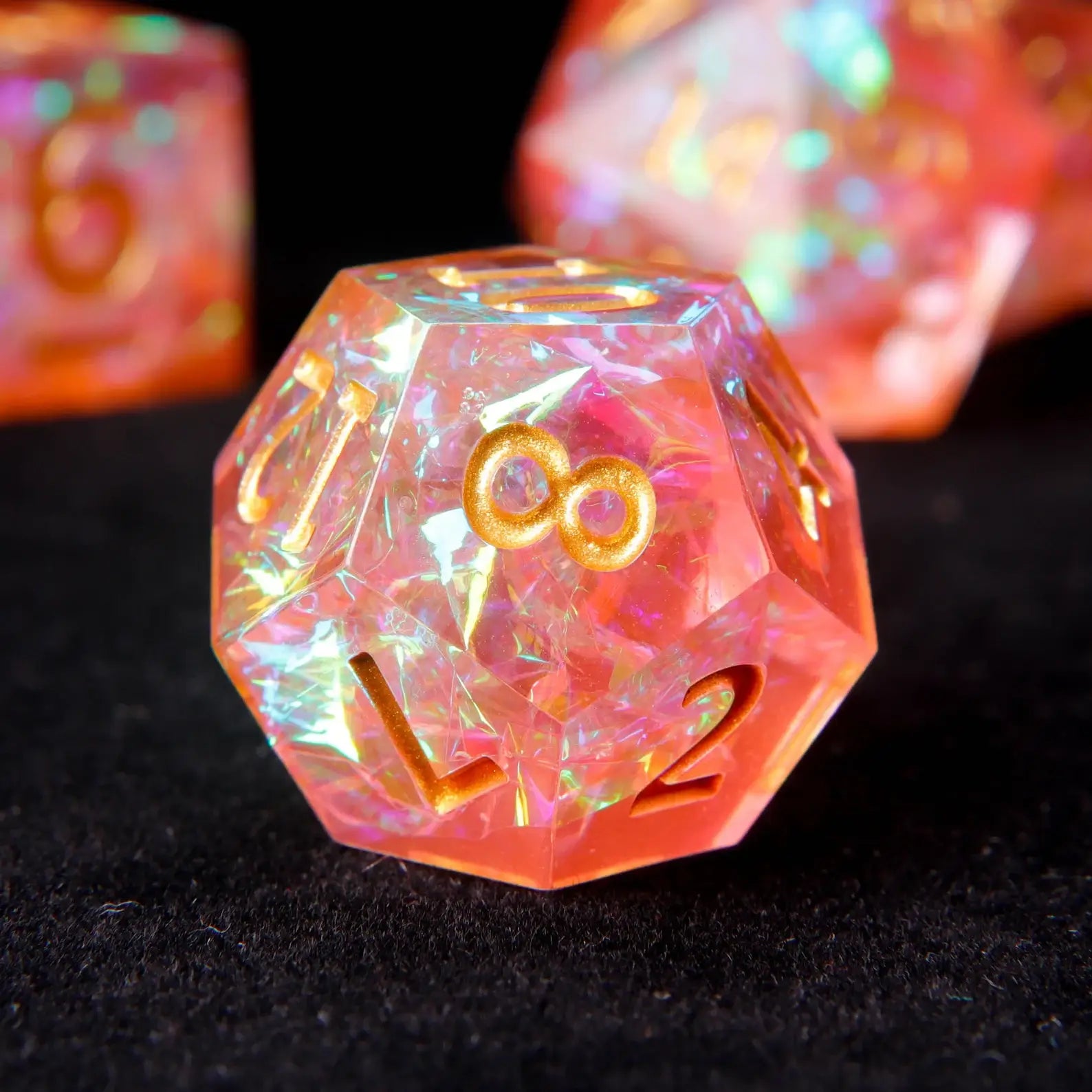 Orange pink holographic resin dice set showcased in a collector metal tin
